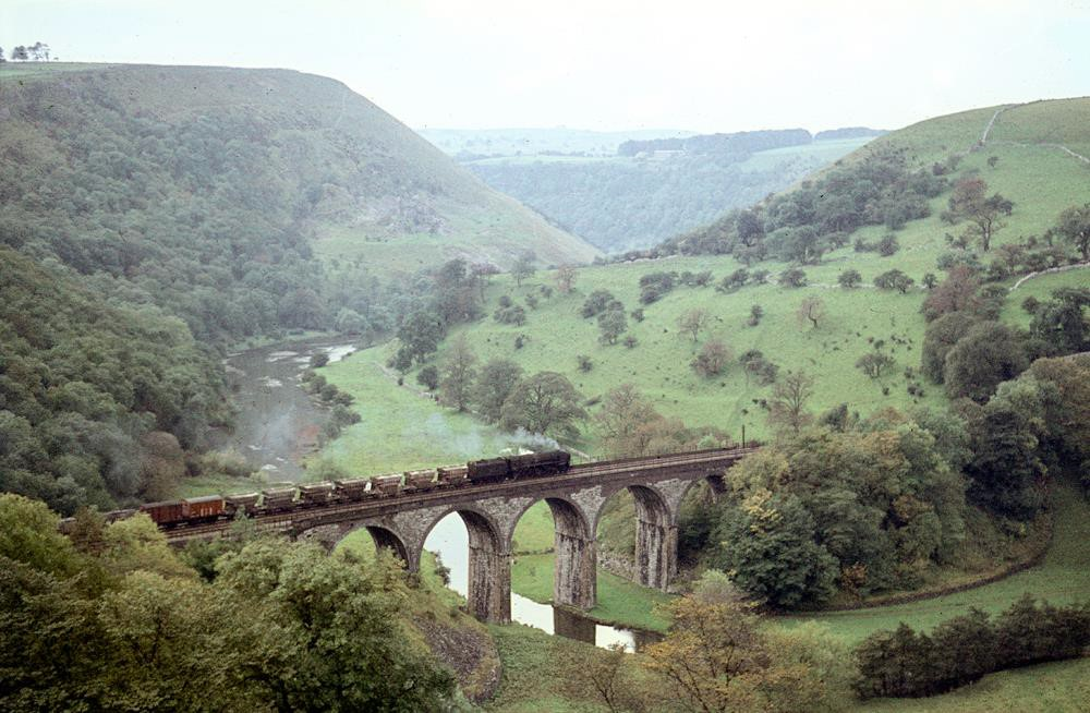 A goods train puffs out smoke as it goes over Monsal Head viaduct in Derbyshire